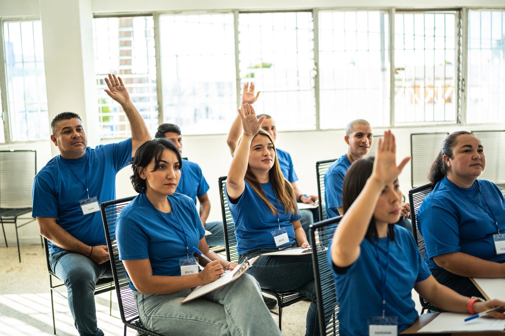 Volunteers with arms raised at a community center