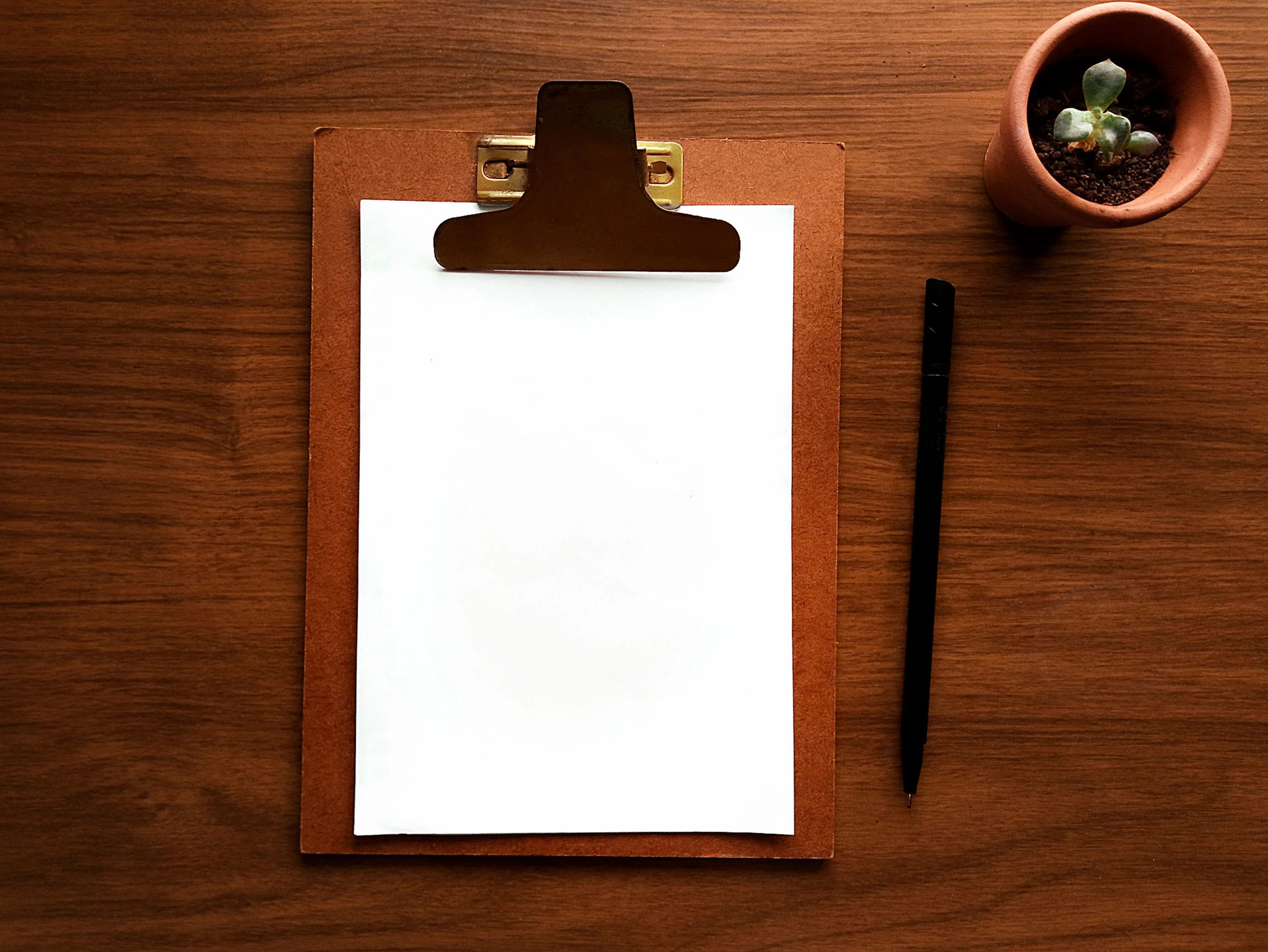 Clipboard and desk setup for content planning