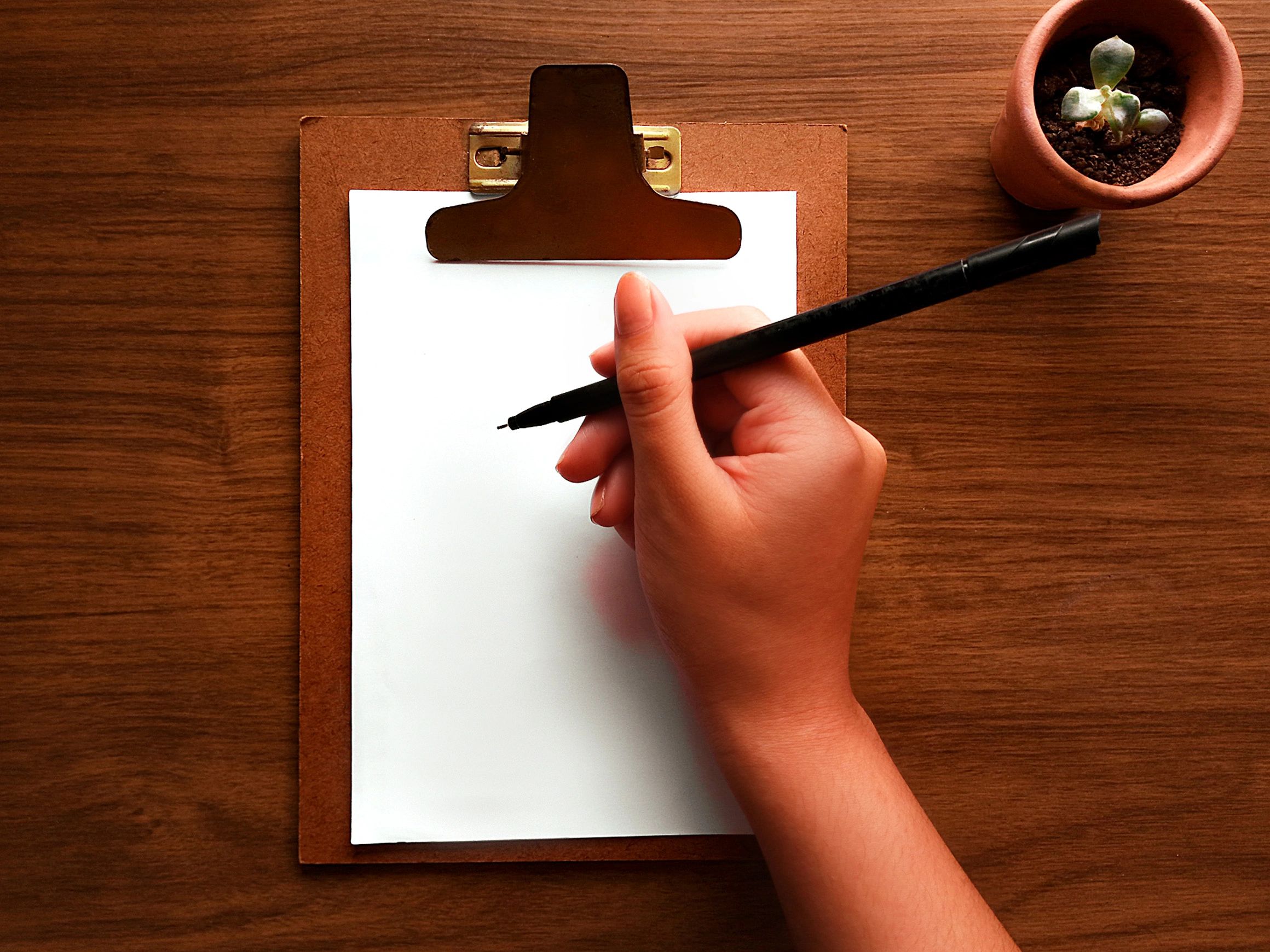 Planning desk with clipboard and pen for marketing strategy