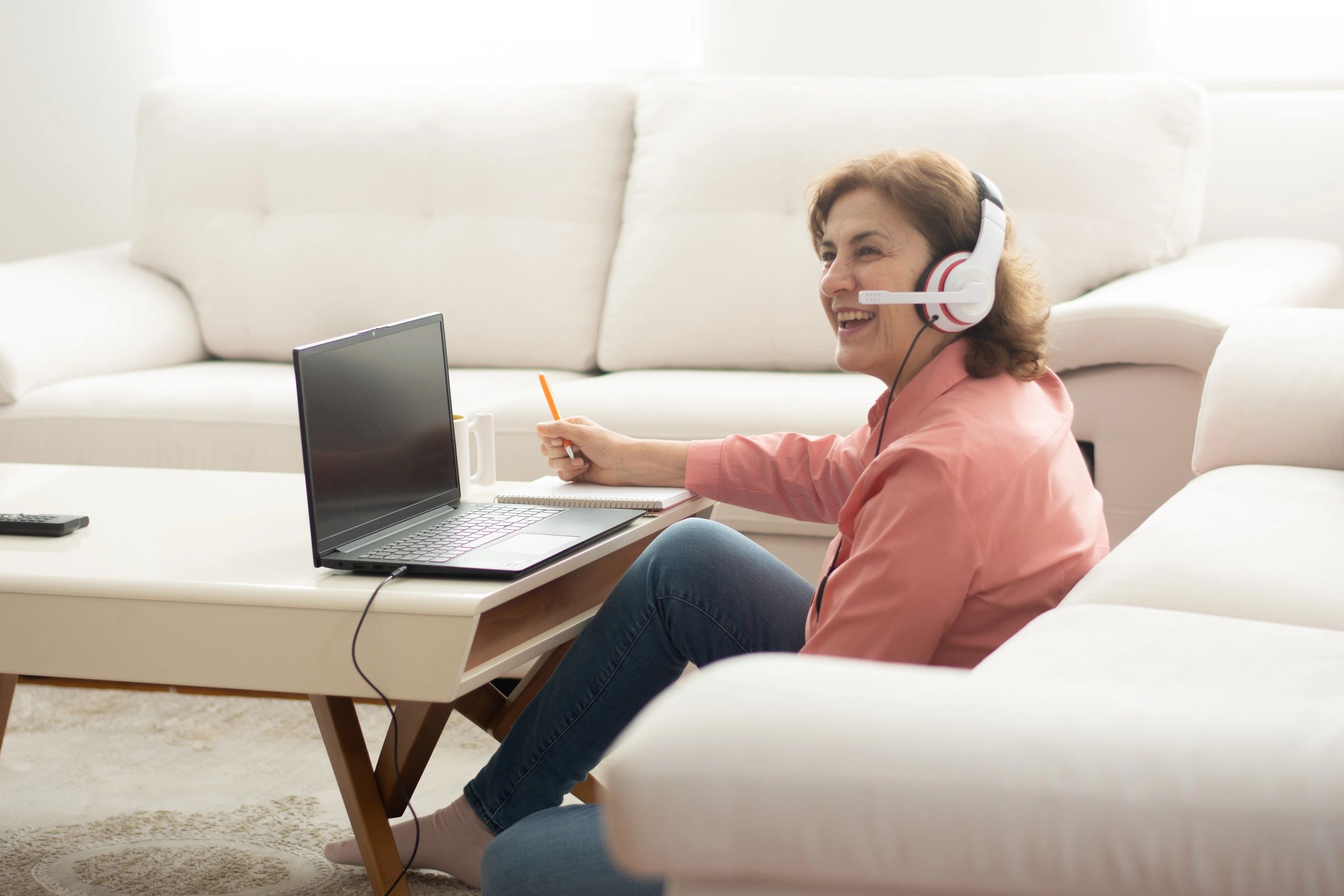Woman studying online using a laptop at home