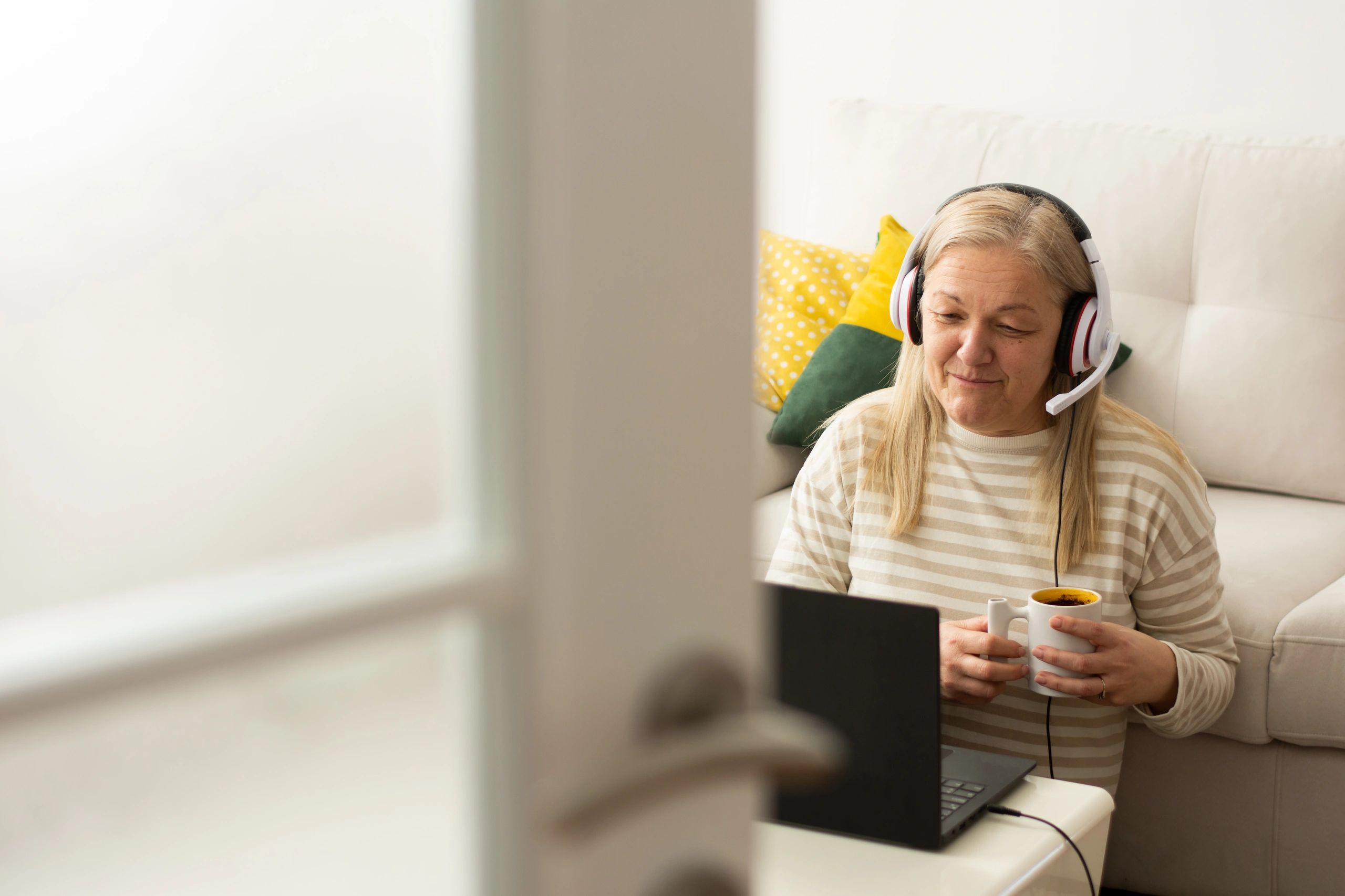 Woman studying on a laptop at home while taking an online course