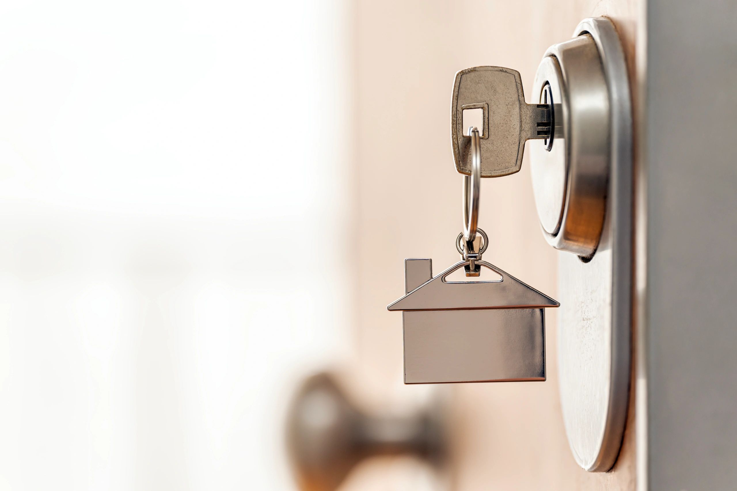 House key inserted into a door lock