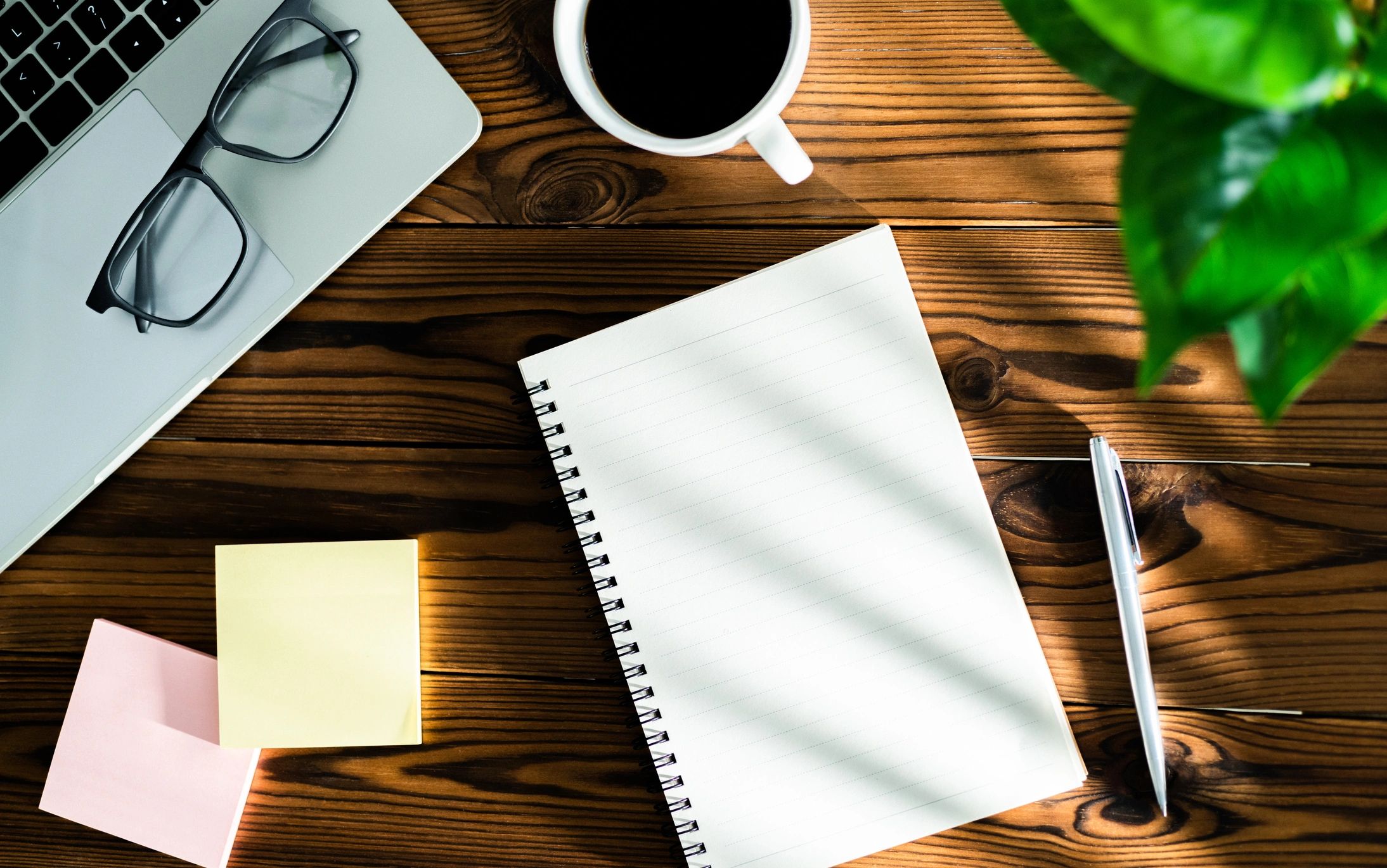 Writing desk with notebook and office supplies