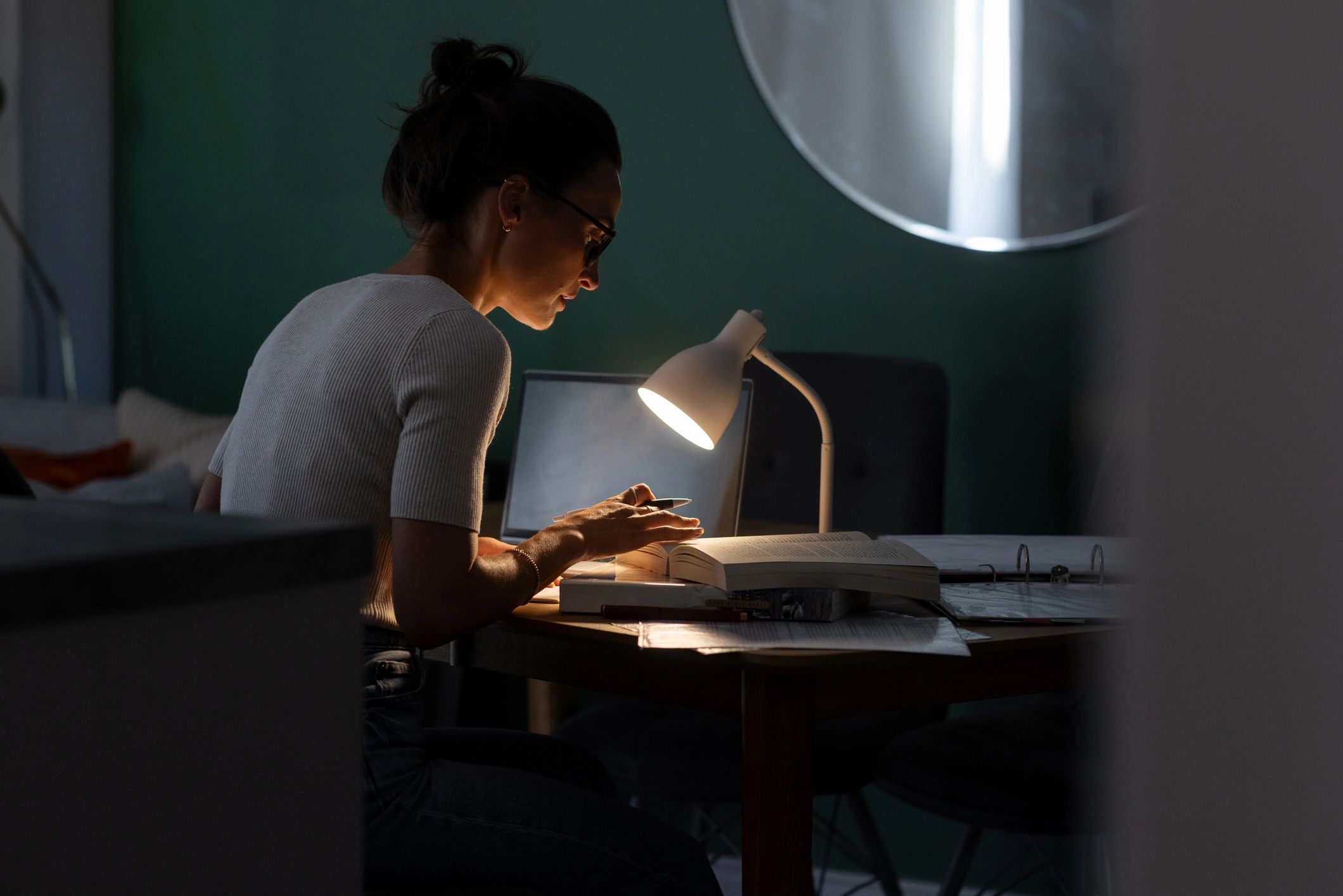 Learner studying with books at home