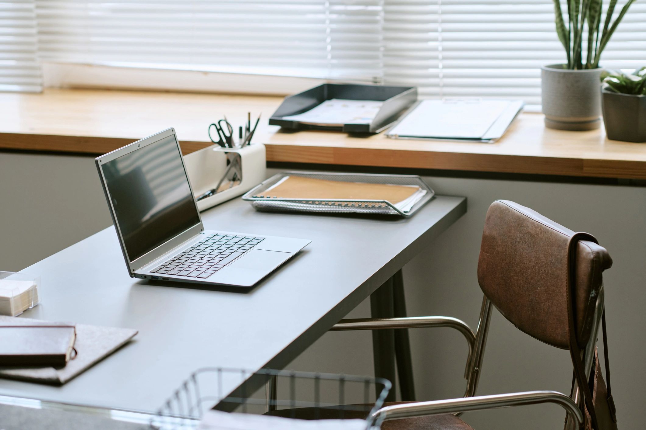 Organized learning workspace with laptop and study materials